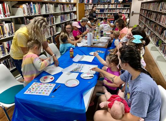 The VZC Library had a great turn out for making a Mother’s Day Craft. Attendees painted glass bottles for the adults and older kids and made finger print magnets for the little kids. Courtesy photo