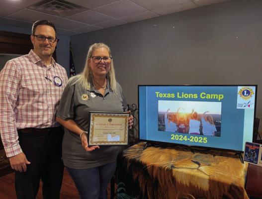 Texas Lions Camp Director Lois Triebenbach was the guest speaker Aug. 8 during the regular weekly Canton Lions Club Luncheon at the Van Zandt Country Club. Presenting Triebenbach with a ‘Certificate of Appreciation’ is Canton Lions Club President Jonathan Helvey. Courtesy photo
