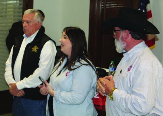 A surprised Van Zandt County Sheriff Joe Carter (far left) learned that he was selected as the recipient of the 2024 ‘Making a Difference’ service award by the Texas Association of Counties (TAC). Making the announcement were Hallie Bever and Kenny Lemons from TAC. The announcement was made Feb. 13 at the VZC Courthouse in the VZC County Court of Law Courtroom. Photo by David Barber