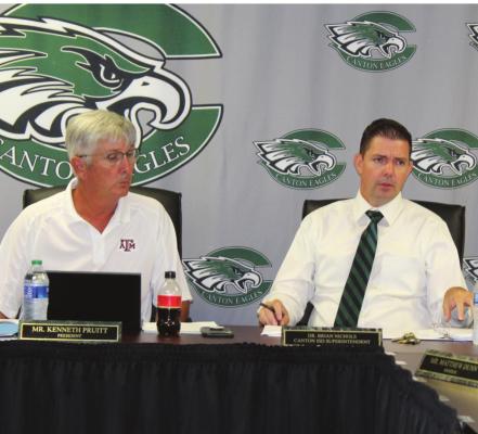 Canton ISD Superintendent Dr. Brian Nichols, right, presented his monthly superintendent’s report July 25 during the regular monthly meeting of the Canton School Board. Listening to the report is Canton School Board President Kenneth Pruitt. Photo by David Barber