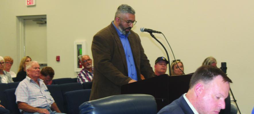 Matt Hernandez, representing the office of Texas District 2 State Representative Brent Money, spoke during the ‘public comments’ portion of the regular monthly meeting Sept. 16 of the Canton City Council. Hernandez spoke on the subject of the Grand Saline Reservoir project. Photo by Susan Harris