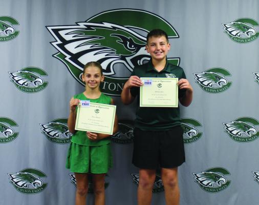 Canton fifth grade students Anne Walters and Hudson Opitz led in the opening prayer and Pledge ofAllegiance Oct. 20 during the regular monthly meeting of the Canton School Board. Photo by Susan Harris