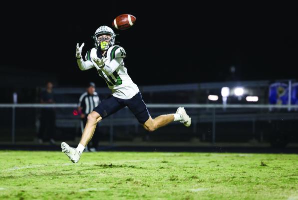 Nash Fenner, the Canton Eagle wide receiver, attempts to make a catch on this pass play against the Quinlan Ford Panthers Oct. 31. The Eagles rallied in the second half for a 35-10 victory to remain undefeated. Canton will host Sunnyvale for the district championship Friday, Nov. 7 in a 7 p.m. kickoff. Photos by Don Johnson