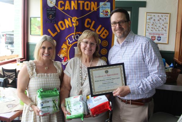 Following her presentation during the May 14 weekly Canton Lions Club Luncheon, Hope Center Executive Director Debbie Brinkley, middle, was presented with a ‘Certificate of Appreciation’by Canton Lions Club President Jonathan Helvey and Canton Lions Club Member Lace Deibert. Photo by David Barber