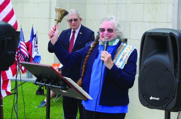 Carrie Woolverton, representing the Daughters of the American Revolution, Neches River Chapter, Van Zandt County, led in the ringing of the bells at the conclusion of a ceremony Sept. 17 on the north side steps of the VZC Courthouse. Those in attendance were each given bells to ring along with Woolverton at exactly 3 p.m. that day to celebrate 237 years of the Constitution of the United States of America. Photo by David Barber