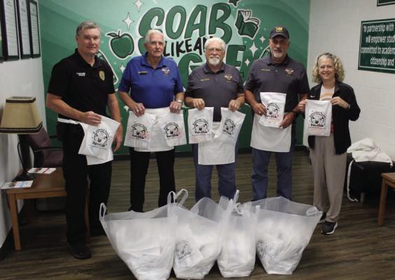Members of Masonic Castillian Lodge No. 141 made their annual visit to Canton Elementary School Oct. 22 to deliver new toothbrushes to approximately 190 CES first grade students. Shown were left to right, Canton ISD Police Officer Dale Baugh; Masonic Castillian Lodge No. 141 members Jimmy Strickland, Chuck Ecord, and Kent Bocook; and CES nurse Kim Davis. Photo by David Barber