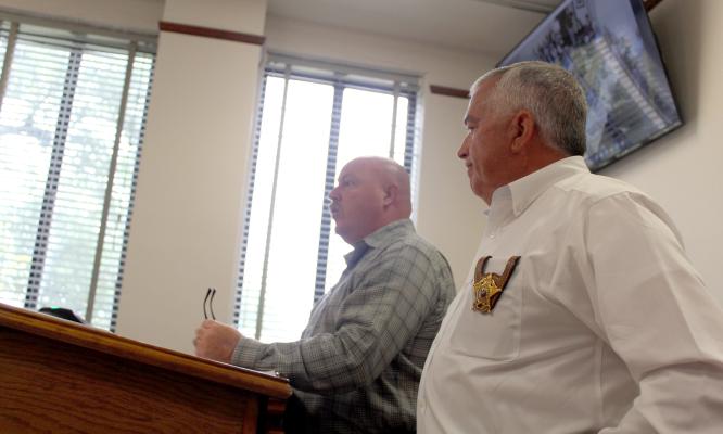 Lt. Joe Maddox of the Van Zandt County Sheriff’s Department (left) and VZC Sheriff Joe Carter discussed the need for a communications and technology administrator in the sheriff’s department during the regular meeting of the VZC Commissioners Court. The commissioners’ court approved Maddox to serve as the new communications and technology administrator in a unanimous vote. Photo by David Barber