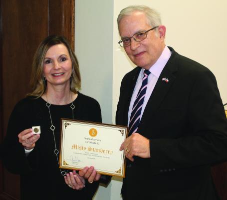 Van Zandt County Tax Assessor-Collector Misty Stanberry was recognized for her five years of service to VZC by VZC Judge Andy Reese. Stanberry was recognized during the regular meeting of the VZC Commissioners’ Court Feb. 26. Photo by David Barber