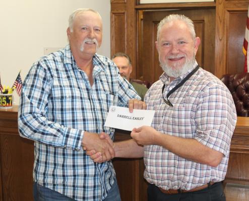 Darrell Easley, left, was recognized for his 36 years of service as he is retiring as the Van Zandt County Pct. 2 foreman. Easley was presented to the VZC Commissioners Court during its special called meeting Oct. 31 by VZC Pct. 2 Commissioner Cliff Williams. Photo by David Barber