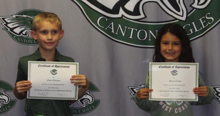 Canton ISD second grade students Nash Williams and Quinn Gordan led in the Pledge of Allegiance and the opening prayer Sept. 16 at the beginning of the regular monthly meeting of the Canton School Board held at the Canton ISD Administration building. Photo by Susan Harris