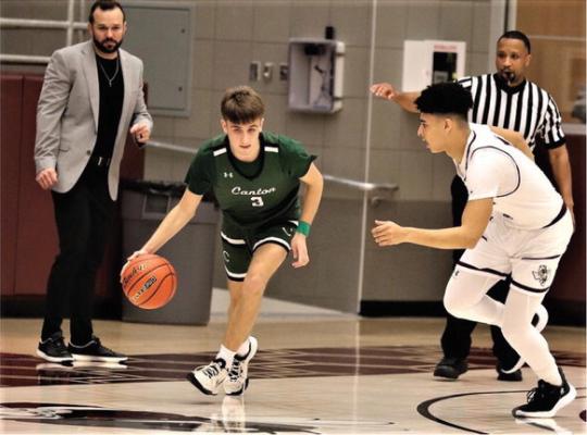 Rex Baldwin drives with the ball during the third quarter of Canton’s loss to Athens on Dec. 20. Photo by Lianna Reid