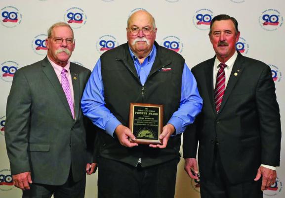 Van Zandt County rancher Brian Cummins (center) was presented the Texas Farm Bureau (TFB) District 5 Pioneer Award on Dec. 2, 2023, by TFB President Russell Boening (right) and TFB District 5 State Director Kevin Wilkerson. Courtesy photo