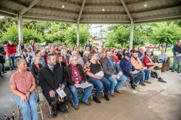 Despite intermittent rain showers and wind, the Annual Memorial Day Program at the Van Zandt County Veterans Memorial in Canton went on as scheduled May 26. Those in attendance viewed the program from the pavilion at the Veterans Memorial. Photos by Faith Caughron
