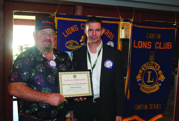 Following his presentation March 25, Canton ISD Superintendent and Canton Lions Club Member Dr. Brian Nichols, right, received a ‘Certificate of Appreciation’ from Canton Lions Club President Sandy Sims at the conclusion of the club luncheon at Van Zandt Country Club. Nichols provided an update on the construction schedule of the new high school and multi-purpose facility Photo by David Barber