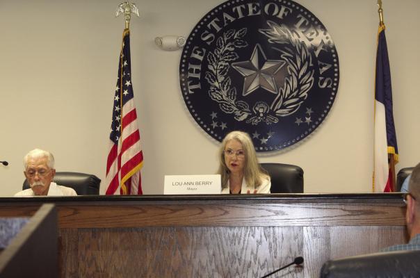 Canton Mayor Lou Ann Berry presented a question for Canton Assistant City Manager Steve Ruppenthal regarding a resolution authorizing the mayor to sign a letter to the Neches and Trinity Valleys Groundwater Conservation District. The resolution opposes Redtown Ranch Holdings LLC’s request for a permit to drill high water wells in the Carrizo-Wilcox Aquifer. The resolution was approved by the Canton City Council in a 3-0 vote on July 3. Photo by David Barber