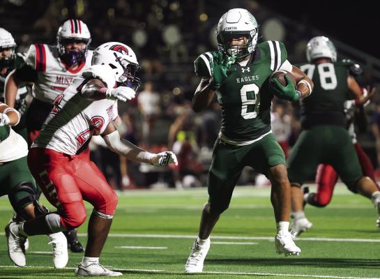 Canton Eagle running back Conrad Bastien looks for first yard yardage on this run against Waxahachie Life Sept. 5 at Norris Birdwell Stadium. Bastien finished the game with 79 yards rushing on 10 carries and two touchdowns as the Eagles breezed to a 52-7 victory to improve their season record to 2-0. Photo by Don Johnson