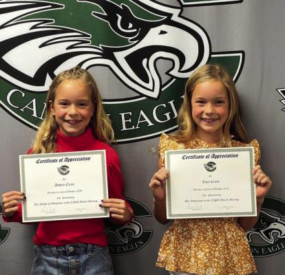 Canton ISD students Lucy Crain and Audrey Crain led in the invocation and the Pledge of Allegiance prior to the start of the regular monthly Canton School Board meeting Oct. 16. Photo by Susan Harris