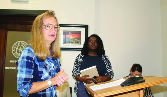 Shannon Barber (right) was introduced as Van Zandt County’s first Civil Assistant District Attorney during the Oct. 11 regular meeting of the VZC Commissioners Court. Barber was introduced by VZC Criminal District Attorney Tonda Curry. Photo by David Barber