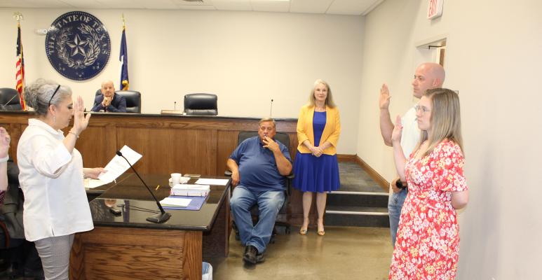 City of Canton Municipal Judge Lilia Durham, left, administers the oath of office to Canton City Council members Randon Sumner and Cassidy Nichole Henderson during the council’s regular monthly meeting May 16. Henderson is in her first term in office. Photo by David Barber