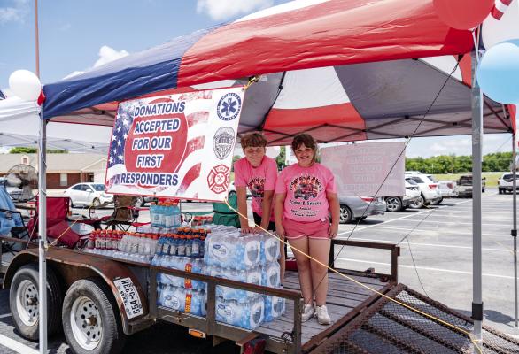 For the fifth consecutive year, Grayson and Alice Weaver, Canton ISD students, collected water, Gatorade, and individually wrapped snacks for local firefighters and First Responders. They set up a donation stand June 29 in front of Shoe Sensations in Canton. Donation totals included 82 cases of bottled water, 18 packs of Gatorade, and 30 cases of snacks. Several monetary donations were received as well. Photo by Faith Caughron