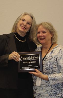 Retiring City of Canton Secretary Debra Johnson, right, was recognized for her 19 years of service during the regular monthly meeting of the Canton City Council Jan. 16. Presenting Johnson with a congratulatory plaque is Canton Mayor Lou Ann Everett. Photo by Susan Harris