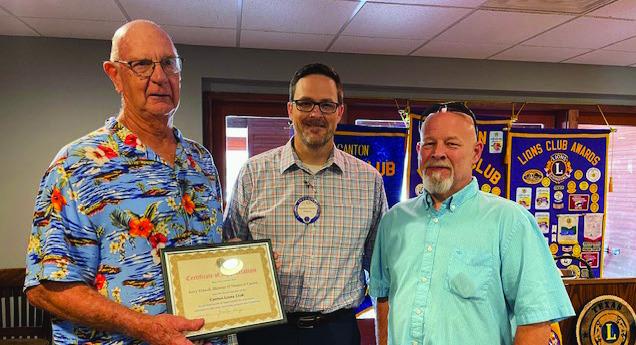 Manna Food Bank Manager Jerry Tidwell, far left, and Manna Food Bank volunteer Matt Stiefer, far right, were the guest speakers Aug. 14 during the weekly Canton Lions Club Luncheon at the Van Zandt Country Club. Presenting Tidwell and Stiefer with a ‘Certificate of Appreciation’ is Canton Lions Club President Jonathan Helvey. Courtey photo