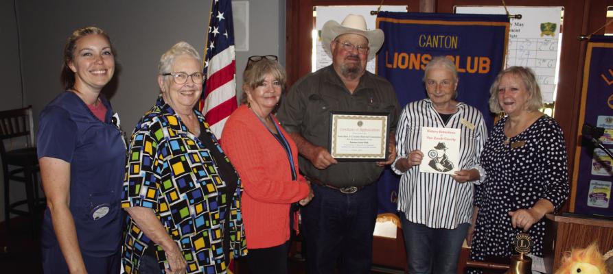 Following their presentation during the weekly Canton Lions Club Luncheon May 20 at the Van Zandt Country Club, members of the Van Zandt County Historical Commission were presented with a ‘Certificate of Appreciation by Canton Lions Club President Sandy Sims, third from right. Representing the VZC Historical Commission were left to right, Heather Haymes, Benja Mize, Suzanne Bass, Ann Nelson, and Debra Johnson. Photo by David Barber