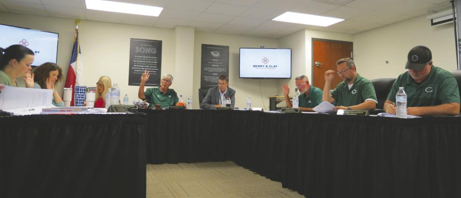 board members approving senate bill 12 compliance certification Photo by Jennifer Fulgham