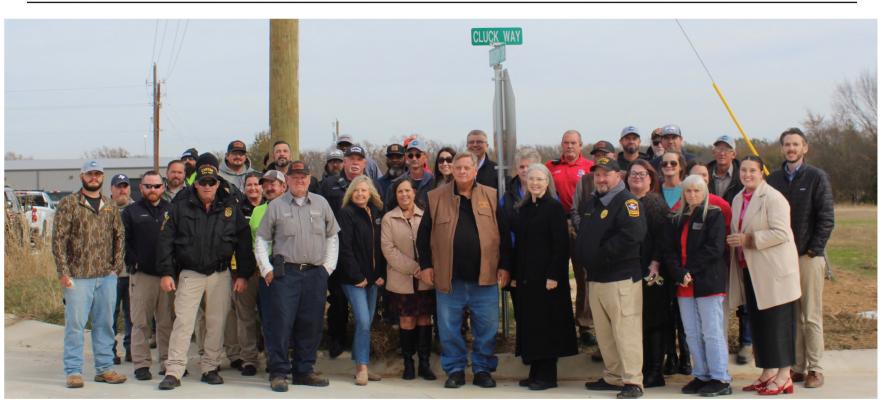 City officials and business leaders turned out strong for the Canton Industrial Park Open House Dec. 16 that featured the unveiling of Cluck Way in honor of Canton City Manager Lonny Cluck. Photo by Susan Harris