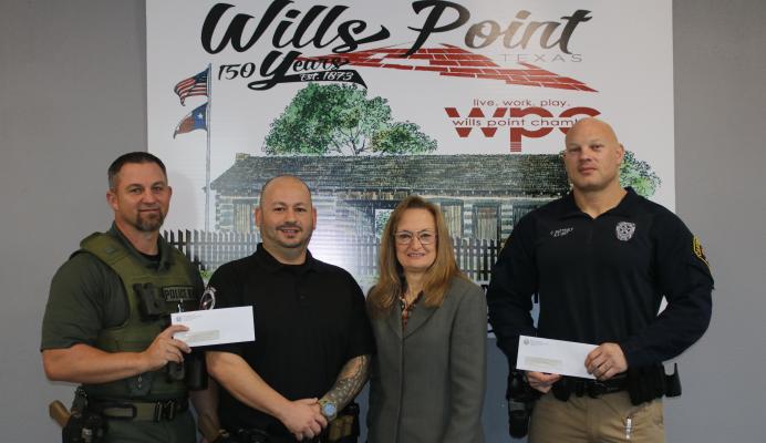 The Wills Point Police Department and the Canton Police Department worked together recently to seize a large amount of drugs and money during a traffic stop on Interstate 20. Van Zandt County Criminal District Attorney, second from right, recognized left to right, Aaron Long and Charlie Hughes from the Wills Point PD and Chad Mattingly of the Canton PD for their efforts. Photo by Susan Harris
