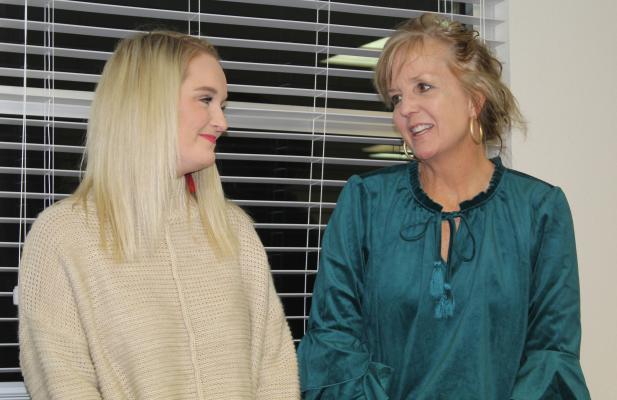 Lauren Morman (left) was recognized as the Canton Elementary School Employee of the Month Dec. 12 during the regular monthly meeting of the Canton School Board. Introducing Morman is Canton Elementary School Principal Kelly Lamar. Photo by David Barber