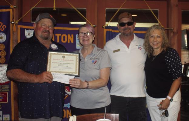 The guest speakers for the July 9 meeting of the Canton Lions Club Luncheon at Van Zandt County Club were Veda and Jerry MacGregor, founders of The Belief Center. Shown with the MacGregors were Canton Lions Club Members Sandy Sims, far left, and Tanya Watkins, far right. Photo by Susan Harris