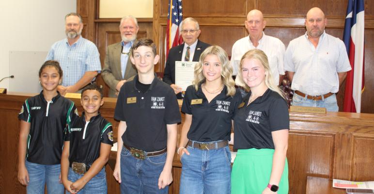In recognition of National 4-H Week during the week of October 6-12, the Van Zandt County Commissioners Court unanimously approved a resolution Sept. 25 during the regular meeting of the commissioners’ court. Standing with VZC Judge Andy Reese and members of the commissioners’court were several members of the VZC 4-H organization. Photo by David Barber