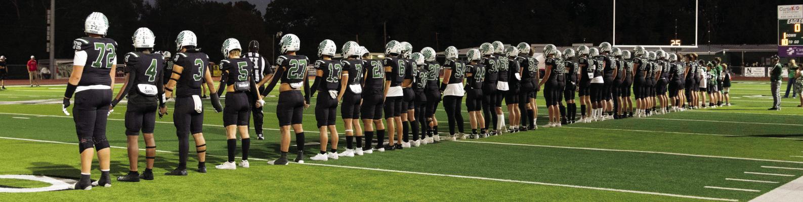 The Canton Eagle football team awaited the results of the opening coin toss prior to their Homecoming game Sept. 27 against the Rusk Eagles. Canton eased past Rusk, 21-3, to improve their undefeated season mark to 5-0 heading into their bye week. Canton will open District 6-4A, Division 2, play on the road at Kemp Friday, Oct. 11. Photo courtesy of the Canton High School Yearbook Staff