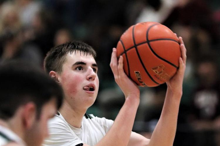 Senior Layne Etheridge knocks down a free throw in overtime against Sunnyvale, one of his 15 points on the night. Photo by Lianna Reid