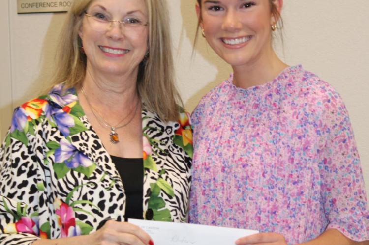 Canton Mayor Lou Ann Everett presented Emory Rhoten with the City of Canton First Monday scholarship.