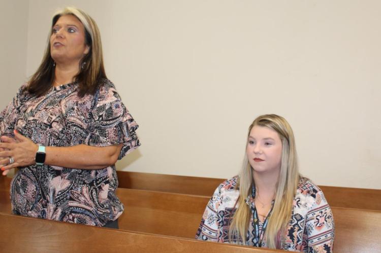 Van Zandt County Human Resource Director Jessica Deville (left) introduced new Assistant VZC Human Resource Director Emily Bettinger during the regular meeting of the VZC Commissioners Court. Photo by David Barber