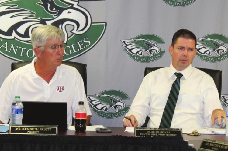 Canton ISD Superintendent Dr. Brian Nichols, right, presented his monthly superintendent’s report July 25 during the regular monthly meeting of the Canton School Board. Listening to the report is Canton School Board President Kenneth Pruitt. Photo by David Barber