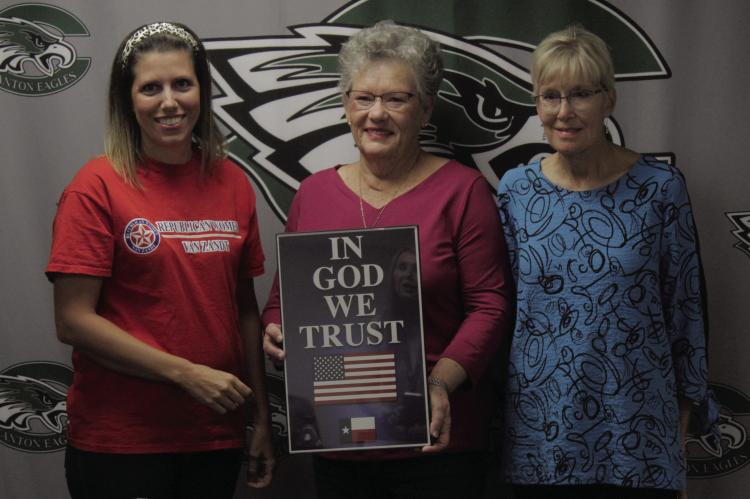 Members of the Republican Women of Van Zandt presented posters reading “In God We Trust” to each Canton ISD campus. Photo by Ethan Adams