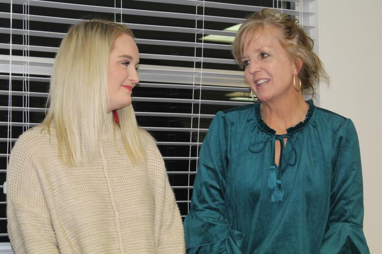Lauren Morman (left) was recognized as the Canton Elementary School Employee of the Month Dec. 12 during the regular monthly meeting of the Canton School Board. Introducing Morman is Canton Elementary School Principal Kelly Lamar. Photo by David Barber