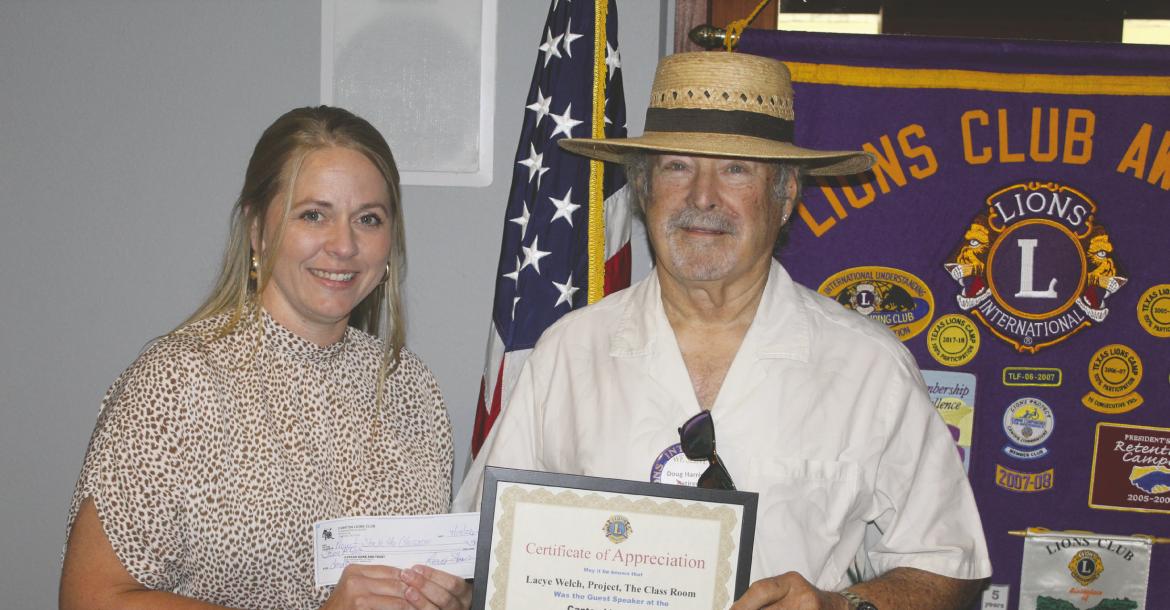 Following her presentation July 8 during the Canton Lions Club’s weekly luncheon at the Van Zandt Country Club, Lacye Welch, representing the ‘Project Stock the Classrooms’ organization, received a ‘Certificate of Appreciation’ from new Canton Lions Club President Doug Harrison. The Canton Lions Club members in attendance also voted to give the organization a $500.00 donation. Photo by David Barber