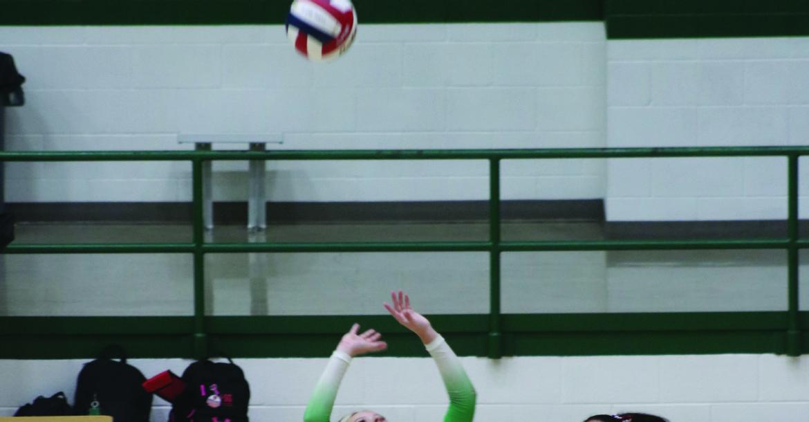 Jordyn Marker (#1) sets the ball during the district match in Mabank between the Panthers and the Canton Eaglettes on September 11th. Photo by Blaine Clamon