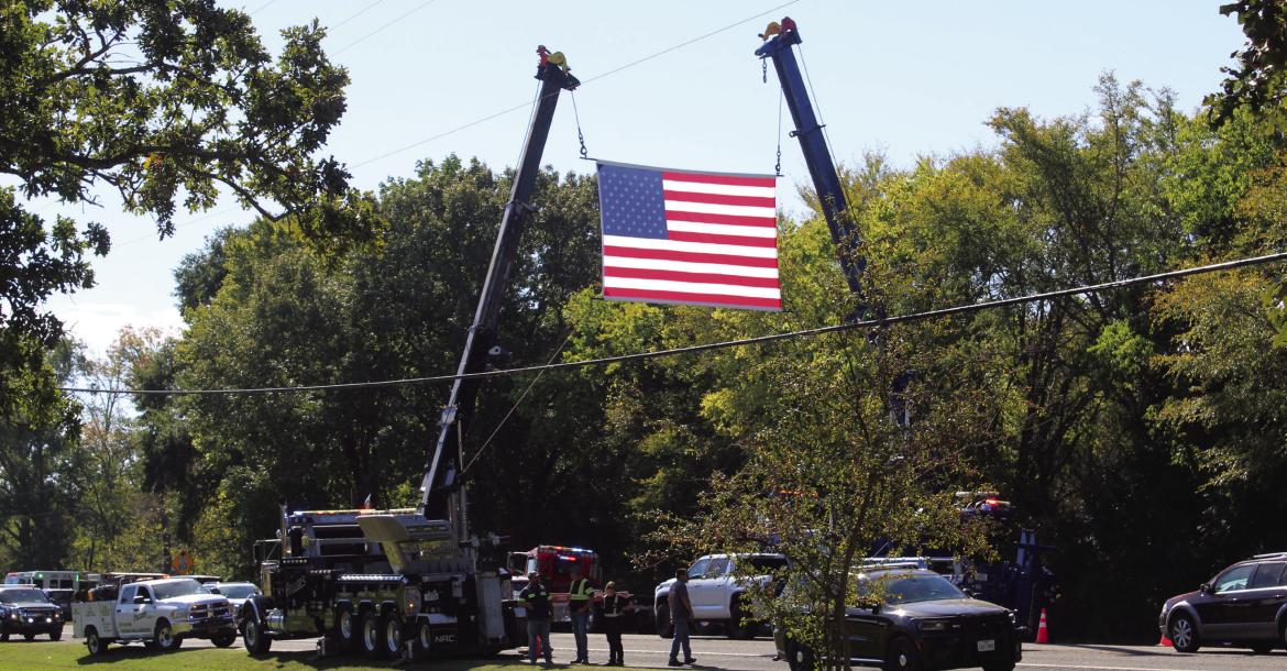 Hundreds of people lined up along the highways to honor the memory of Van Zandt County Deputy Adam Sherifi, who was killed in the line of duty serving a warrant Oct. 20 on State Highway 198. The public procession started at the Dallas County Medical Examiner’s Office and concluded at Eubank Funeral Home in Canton. Services for Deputy Sherifi were held Oct. 28 in Canton. Photo by Melody Tarno-Thompson