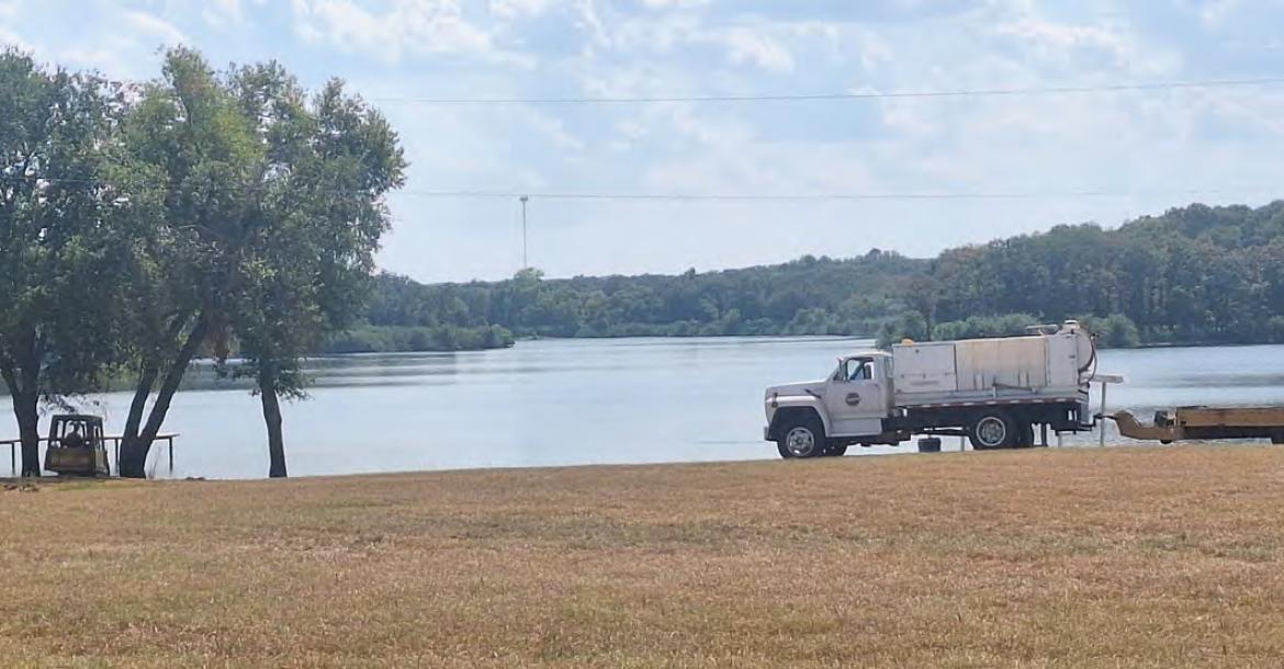 Following the placement of a sign last week at the Mill Creek Reservoir in Canton prohibiting swimming between the boat docks, work has begun on creating a specified swim area, with a beach, for families to enjoy swimming without being in the restricted areas. Photo by Don Johnson